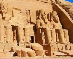 The Great Temple of Ramesses II at Abu Simbel with four colossal statues carved into a rock cliff.