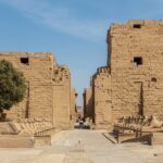 Entrance pylon of the Precinct of Amun-Re at Karnak Temple Complex, Luxor, Egypt, with an avenue of sphinxes.
