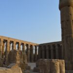 Luxor Temple complex on the east bank of the Nile in Luxor, Egypt, illuminated at night.