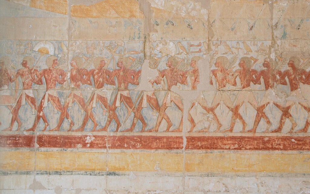 "Wall relief inside the Hathor Chapel of Hatshepsut’s Mortuary Temple at Deir el-Bahari, showing a ceremonial procession."