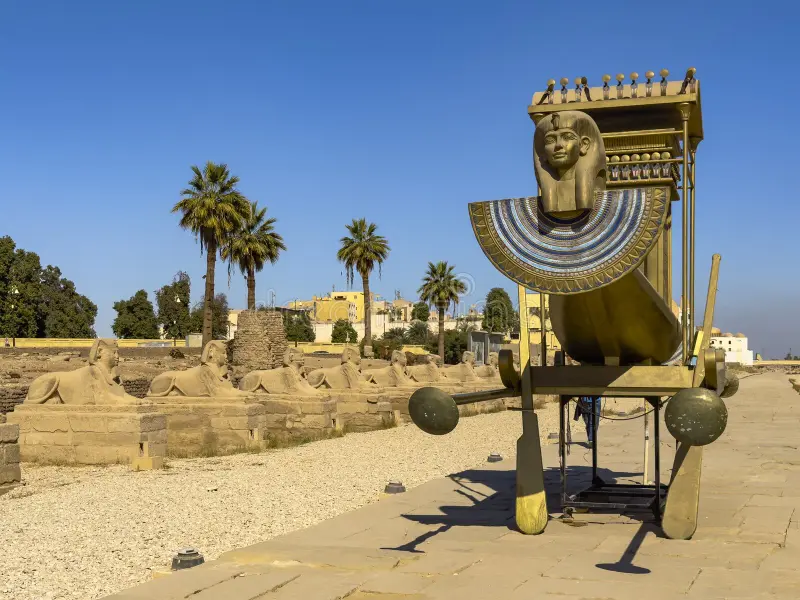 "Replica of a processional barque and the Avenue of Sphinxes at Luxor Temple in Egypt."